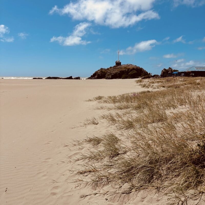View of sandy beach and ocean at Sumner Bay in New Zealand